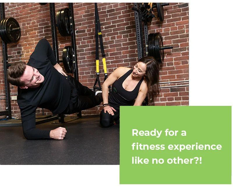 like-no-other A man does a side plank on a gym floor with a female trainer assisting; gym equipment is visible in the background. Text reads: "Ready for a fitness experience like no other?!.