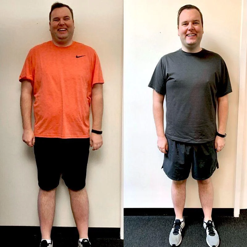 nathan A man stands against a white wall in two side-by-side photos, showing a noticeable weight loss transformation. In the left image, he wears an orange shirt; in the right, a gray shirt.