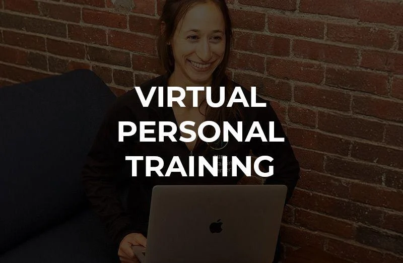 A woman sits with a laptop in front of an exposed brick wall, with the words "Virtual Personal Training" overlaid on the image.