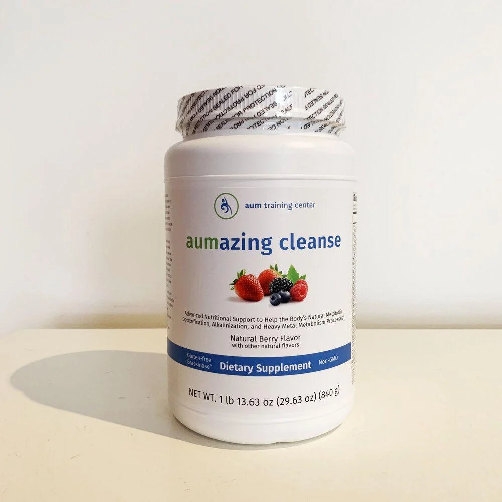 A white container labeled “aumazing cleanse” dietary supplement with a berry image, blue and white accents, and a sealed silver lid.