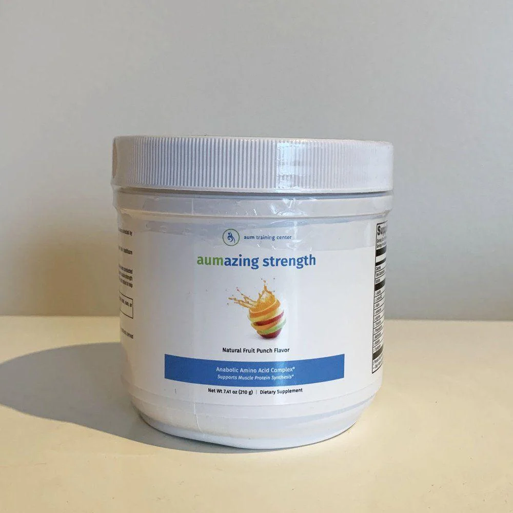 A white plastic container labeled "aumazing strength" with natural fruit punch flavor, placed on a plain surface against a light background.