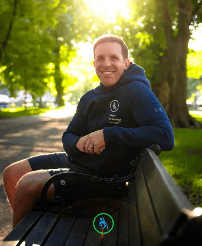 Chris Carreiro founder of AUM Training Center sitting in Boston Public Garden